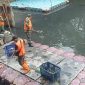 Gerak Cepat Satgas Sampah Koramil 03/GP Bersihkan Waduk Wijaya Kusuma dari Tumpukan Sampah